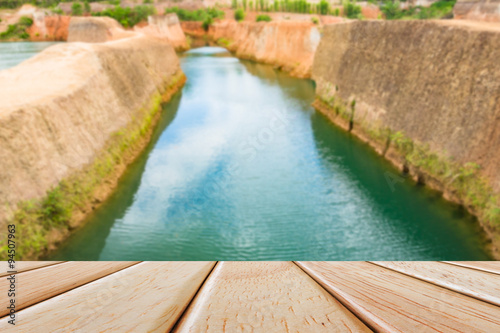 Empty Wooden deck table over blur nature background