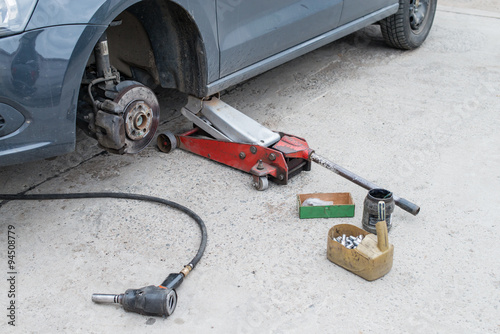 Close up of different tools for wheel change (shallow DOF)