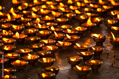 Burning candles in Buddhist temple