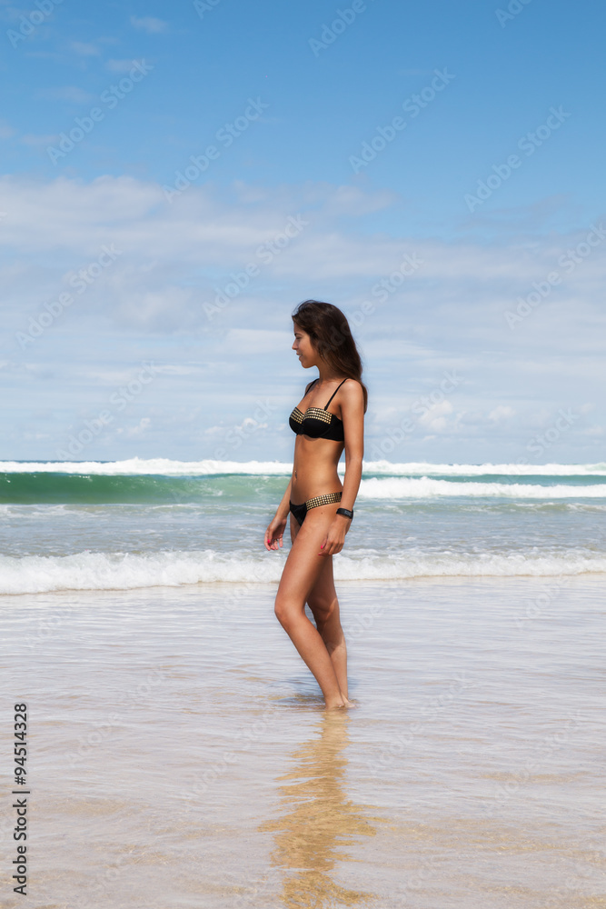 Young pretty woman on a beach