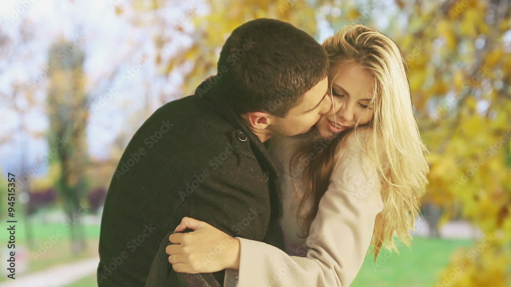 Man and woman kissing madly beautiful in the autumn park. Man and woman kissing madly beautiful in the autumn park.