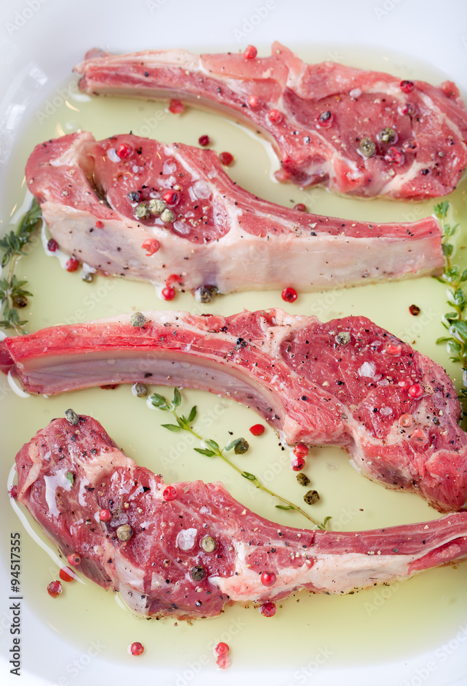 Obraz premium Raw meat, mutton, lamb rack with marinated 