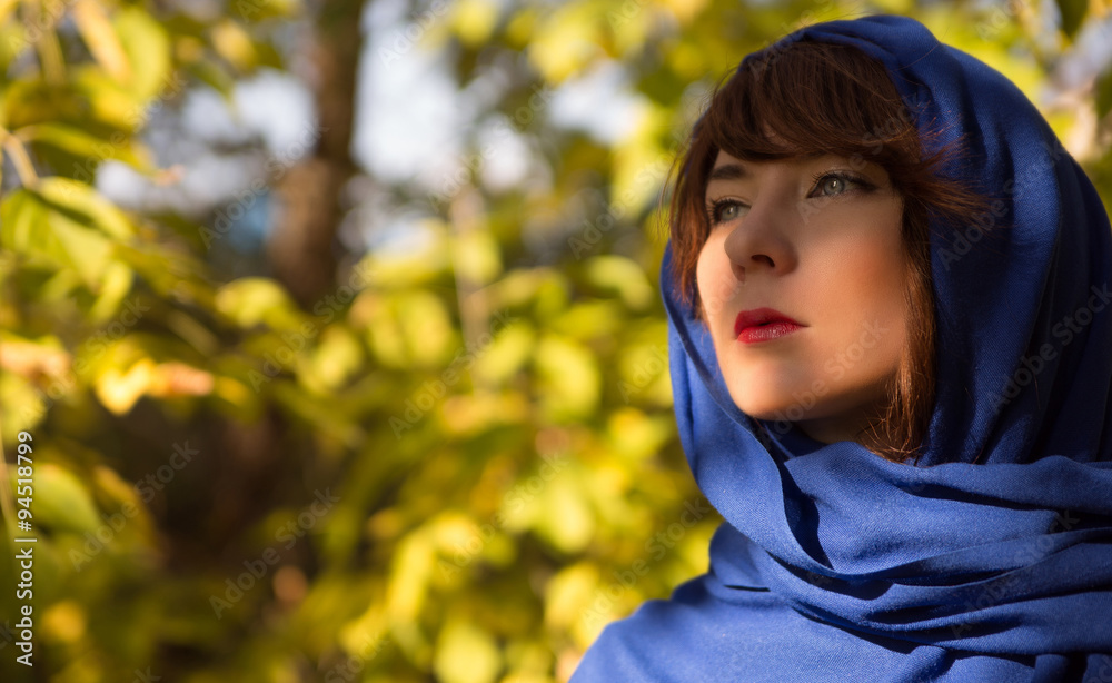 Beautiful young elegant woman wearing ivory shawl on autumn day Beautiful young elegant woman wearing ivory shawl on autumn day