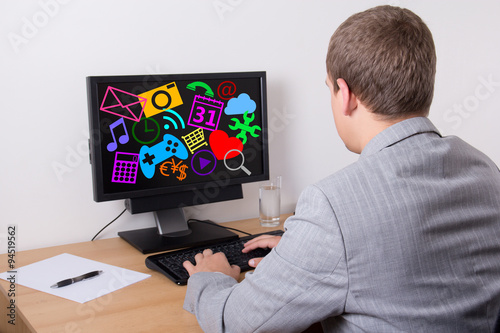 business man using personal computer with different applications