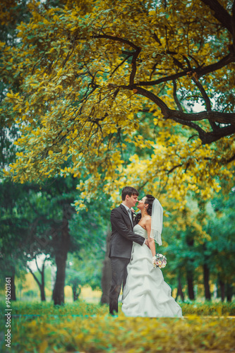  beautiful young couple stand on background forest