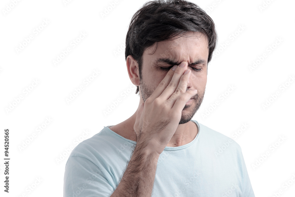 Sinus pain, sinus pressure, sinusitis. Sad man holding his nose Sinus pain, sinus pressure, sinusitis. Sad man holding his nose