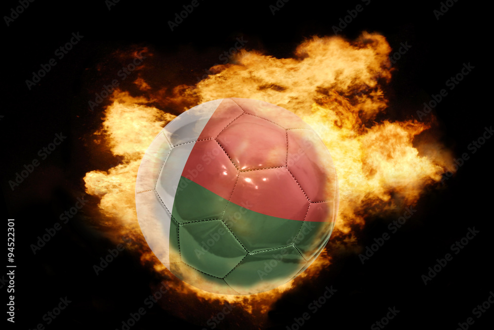 Fototapeta premium football ball with the flag of madagascar on fire