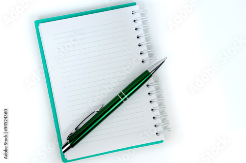 Notebook and pen on white background 
