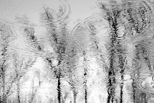 Raindrops leave circles and traces of water