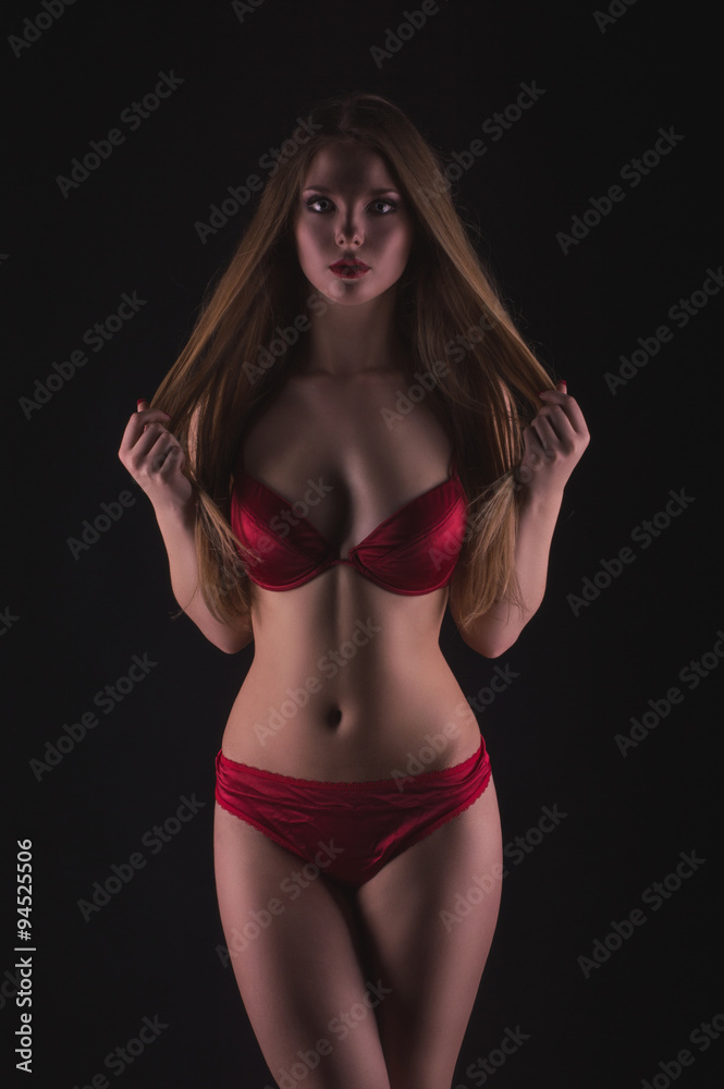 Hot blonde woman in lingerie posing in the studio Hot blonde woman in lingerie posing in the studio