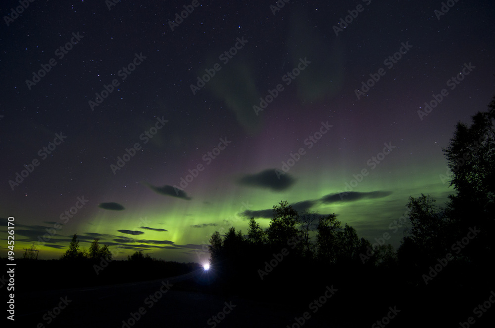 Naklejka premium polar lights / An aurora is a natural light display in the sky, predominantly seen in the high latitude (Arctic and Antarctic) regions.
