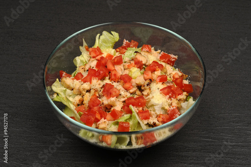 Caesar salad in a transparent bowl
