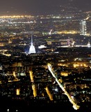Aerial view of Turin with the illuminated symbol of the city
