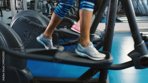 Legs work on elliptical trainer