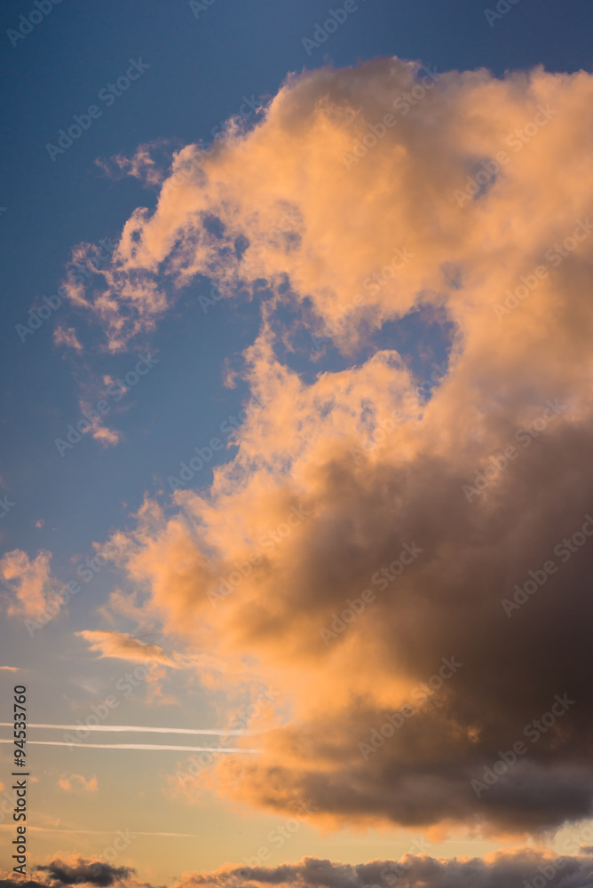 Cloudy sky at sunset or sunrise, orange light Cloudy sky at sunset or sunrise, orange light