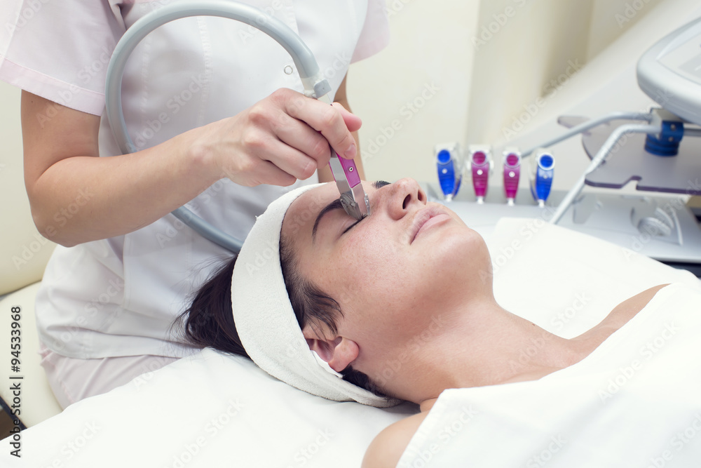 woman passes treatment mask facial at the beauty salon