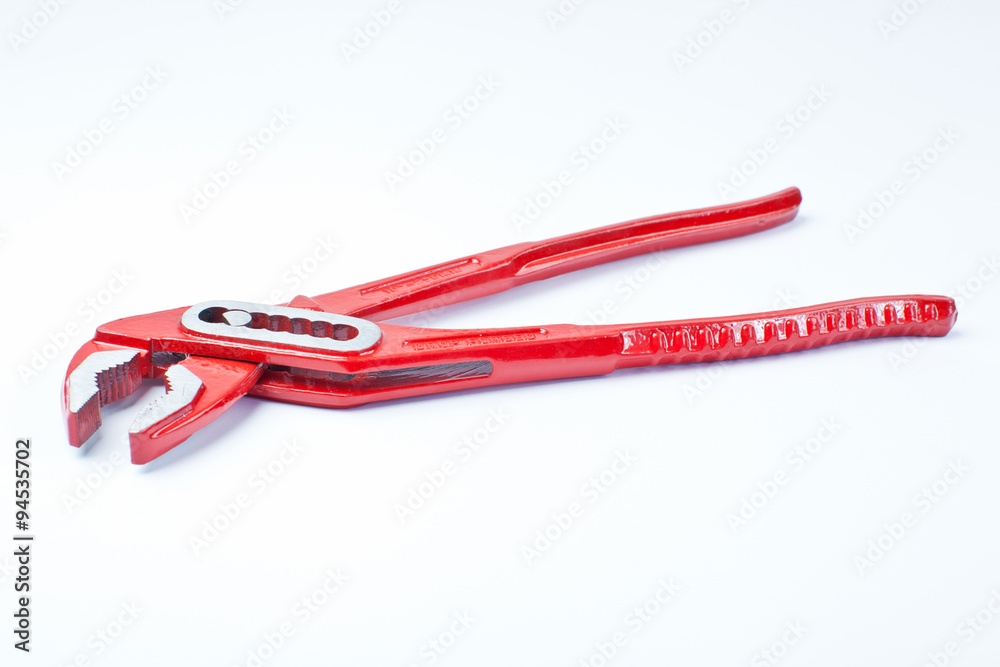 Close up new universal alligator spanner tool on white background