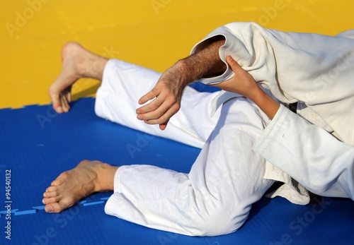 people fight with martial arts during the sporting event