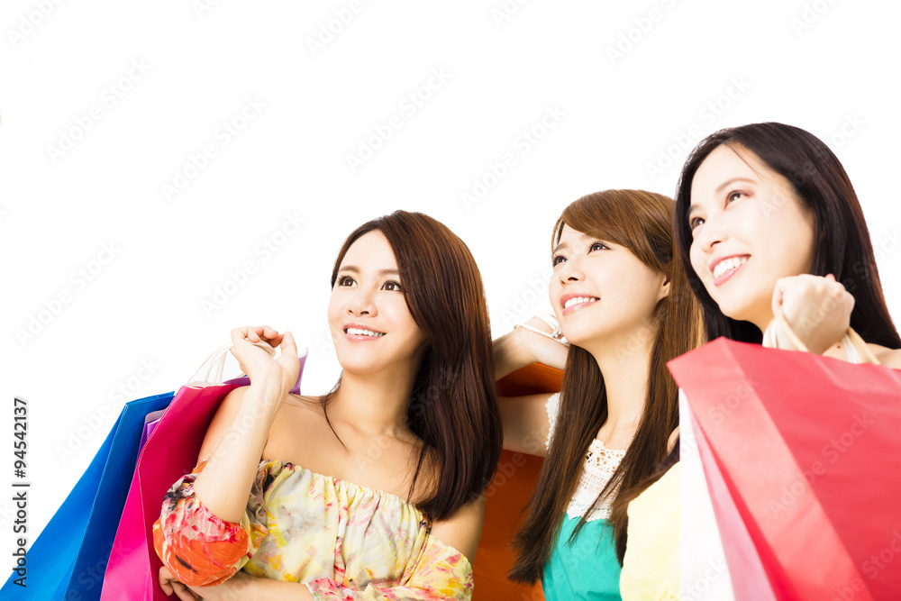 Group of happy young woman with shopping bags looking up Group of happy young woman with shopping bags looking up