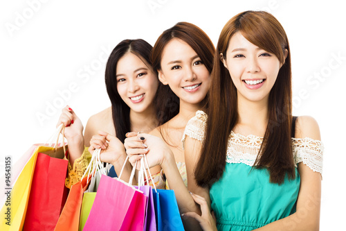 Group of happy young woman with shopping bags