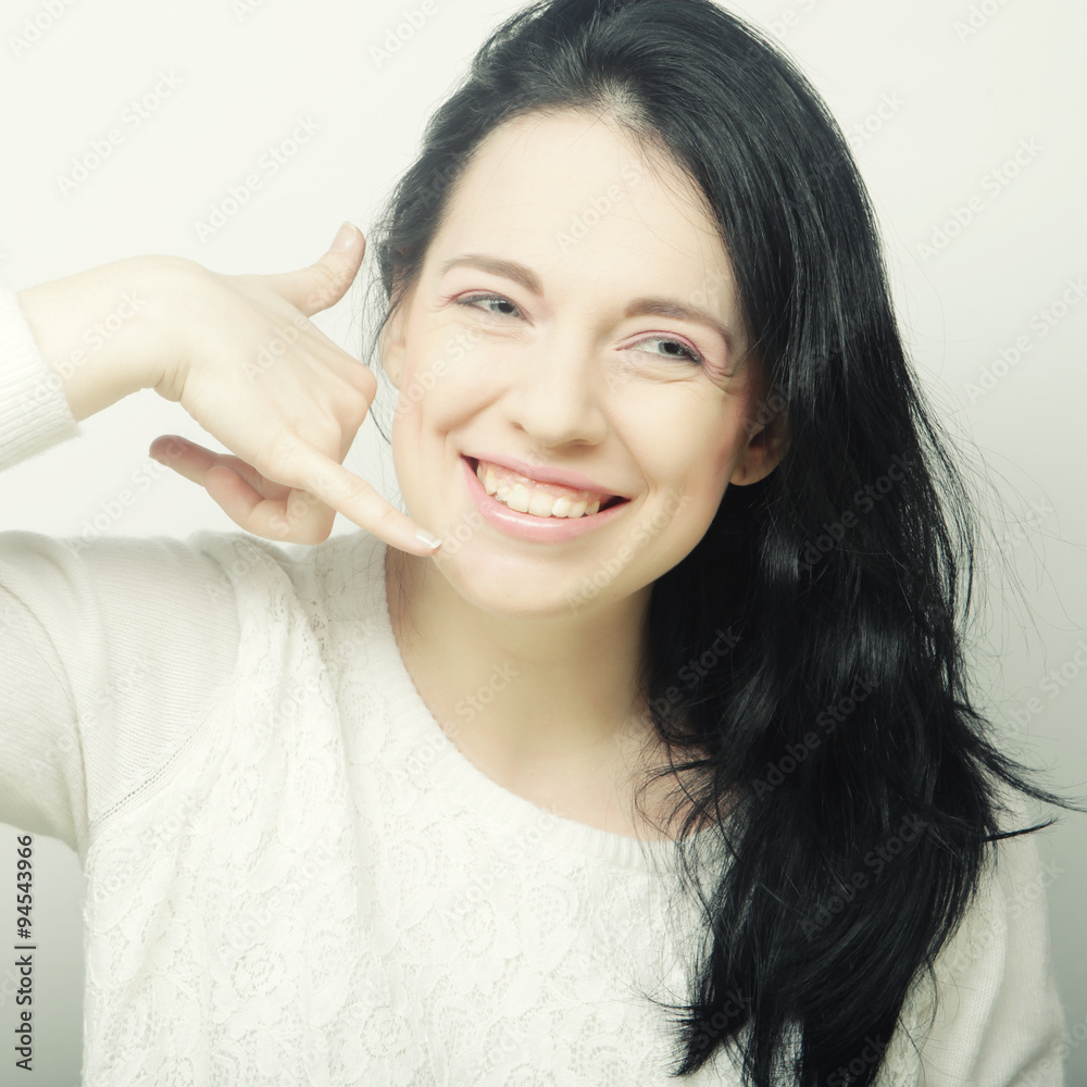 happy woman making a call me gesture happy woman making a call me gesture