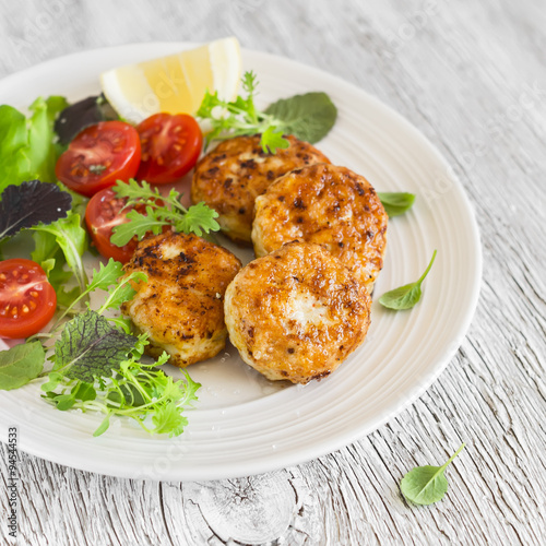 chicken cutlets and fresh vegetable salad