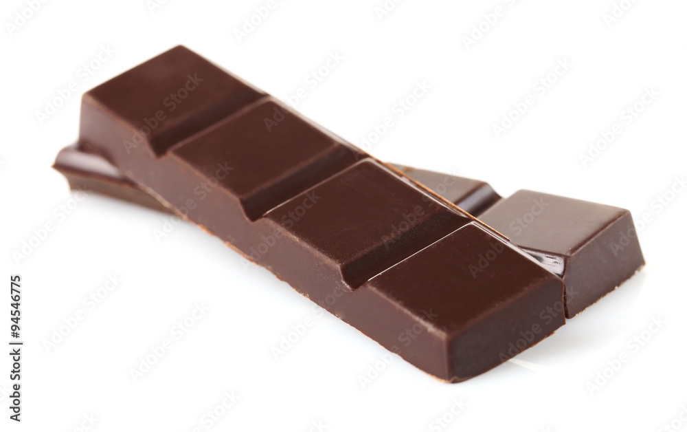 Black chocolate pieces isolated on white background