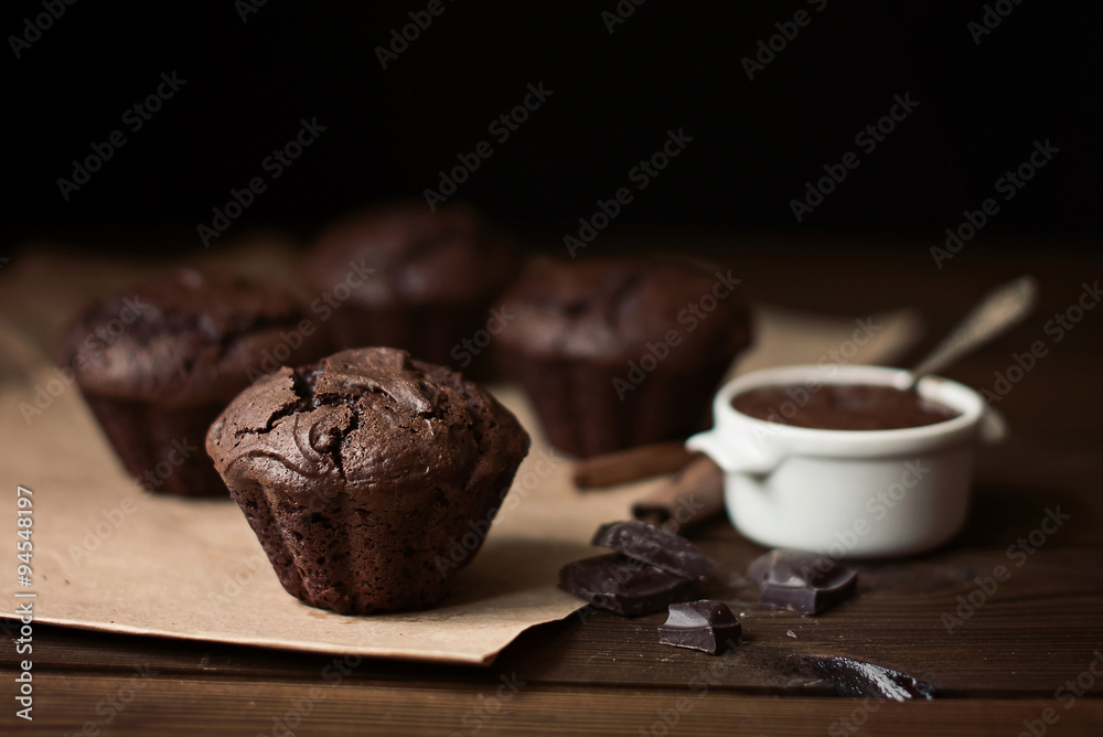 Chocolate muffins on the table, dark background Chocolate muffins on the table, dark background