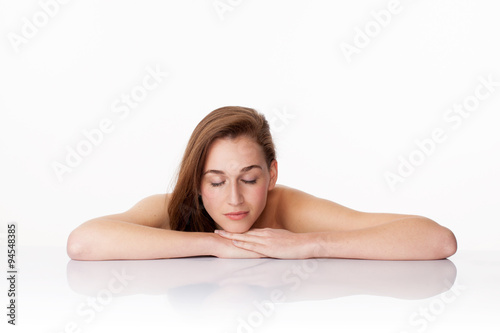 relaxed young woman resting for soothing spa treatment