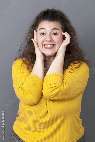 thrilled young fat woman smiling for shy seduction photo