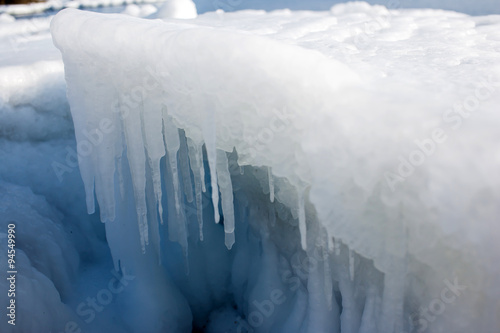 Icicles on the ice, the sea a block of ice on the sea, the ice in the icicles, winter in seas and oceans, Arctic aquatic nature, the ice floe in the ocean, the melting of ice. © maestrovideo