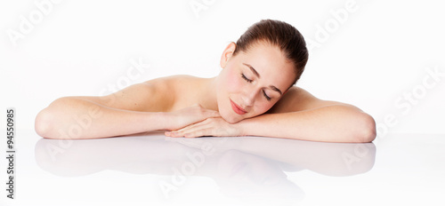 beautiful woman resting after cleansing  hydration and soothing skin treatment