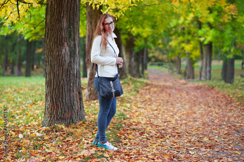 Beautiful woman in autumn park
