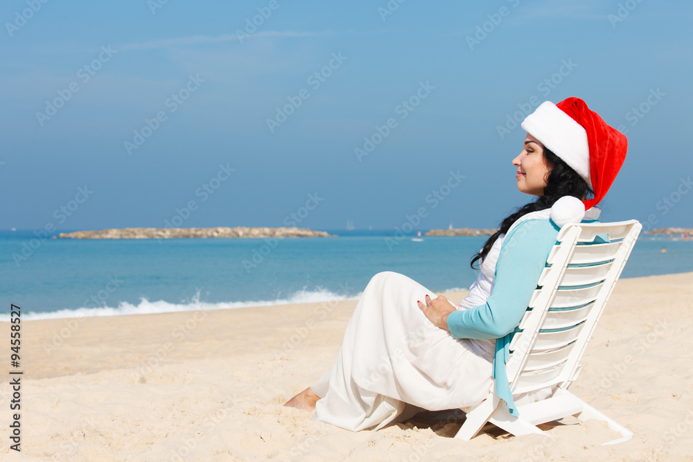 Santa girl at the beach