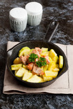 Salmon with zucchini decorated parsley in cast-iron pan