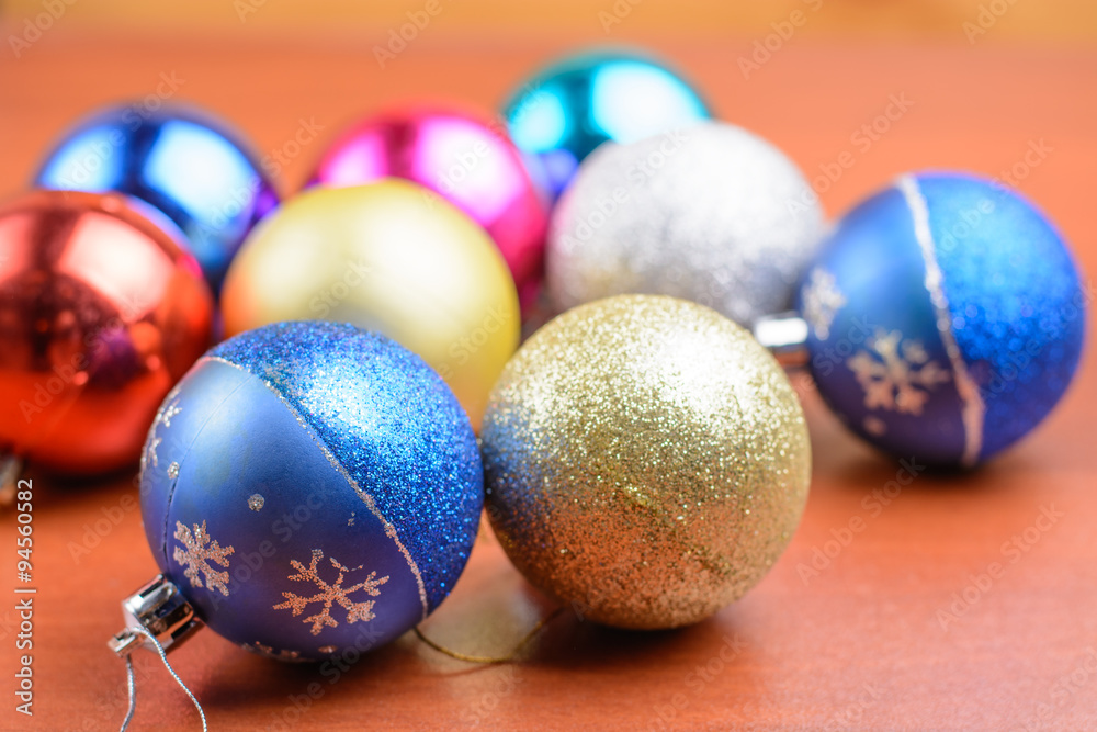 Christmas tinsel and toys on a wooden background Christmas tinsel and toys on a wooden background