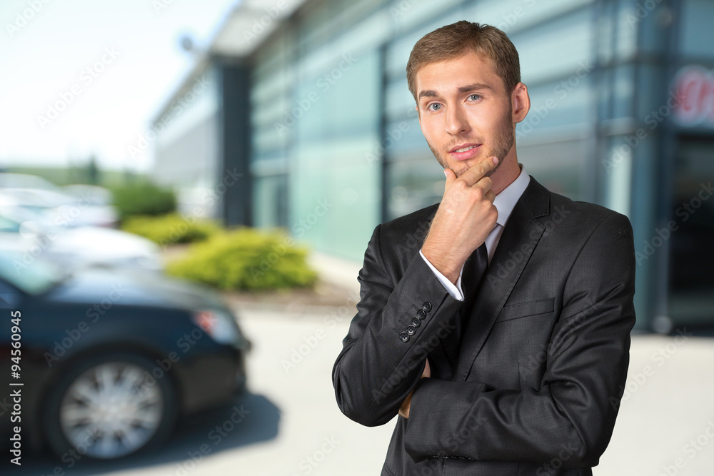 Confused young businessman thinking Confused young businessman thinking