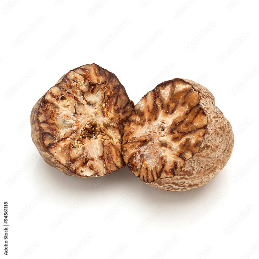 Macro closeup of a cracked Organic Nutmeg Seed or Jaiphal (Myristica fragrans) isolated on white background. Macro closeup of a cracked Organic Nutmeg Seed or Jaiphal (Myristica fragrans) isolated on white background.