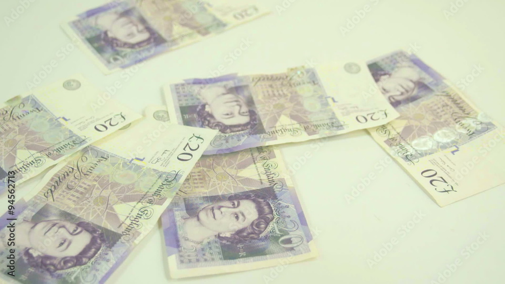 Some of England Pounds bill are flying on the table. The total bills are 150 Pounds in all Some of England Pounds bill are flying on the table. The total bills are 150 Pounds in all