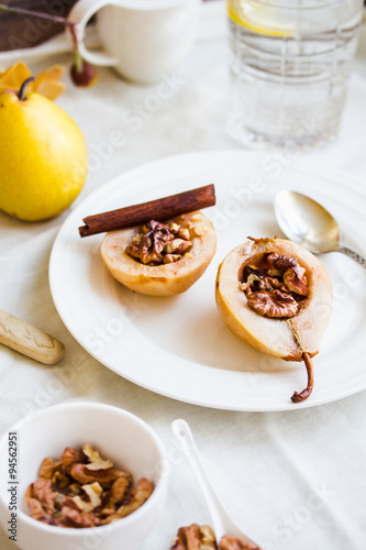 spicy baked pear with walnuts, honey, healthy dessert,selective