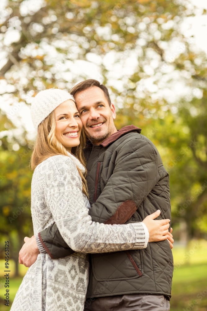 Fototapeta premium Portrait of smiling young couple embracing