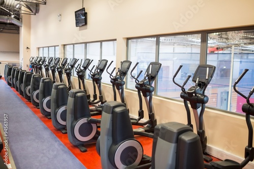 Collection of cross trainer machines in a row