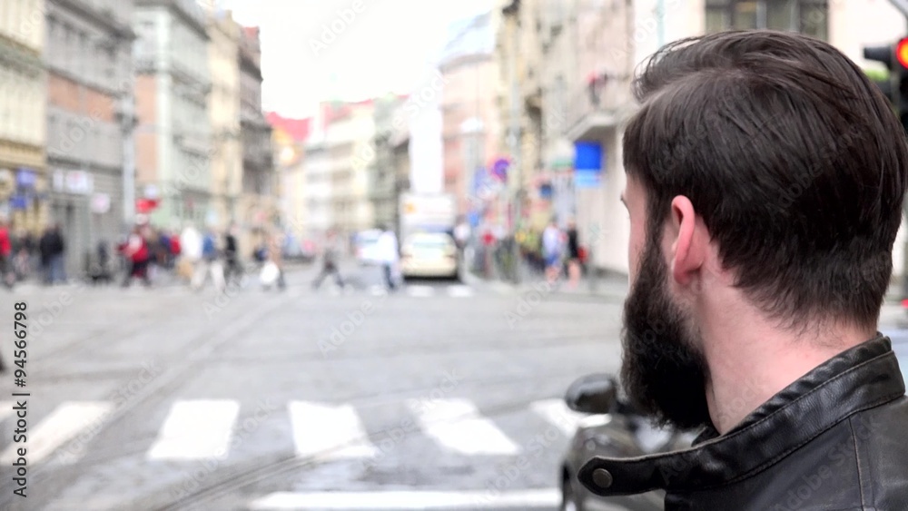 young handsome hipster man looks around - city - urban street - closeup face young handsome hipster man looks around - city - urban street - closeup face