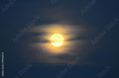 full moon with veil of clouds