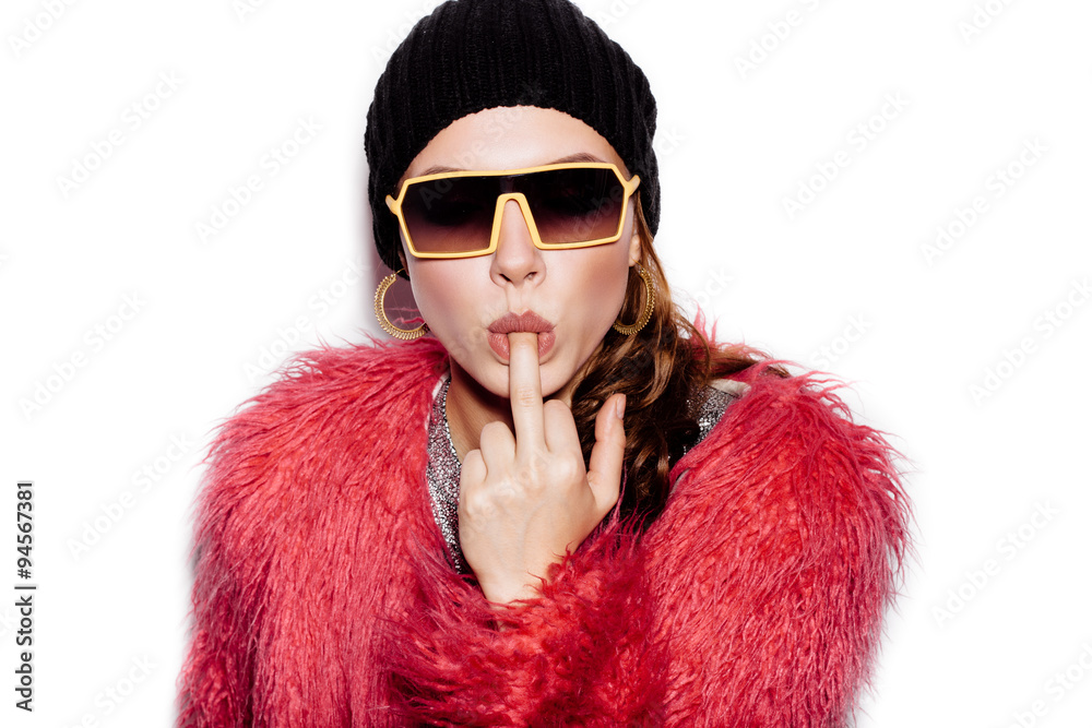 young Woman kissing middle finger on white background young Woman kissing middle finger on white background