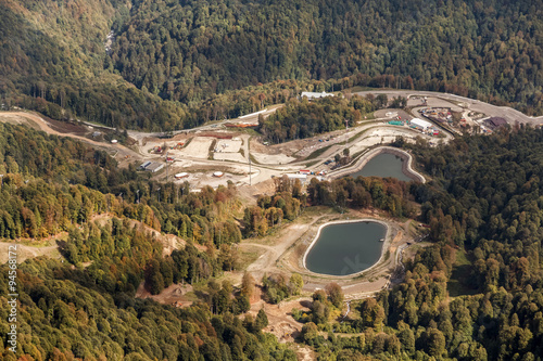 Water reservoir for snow guns on ski slopes
