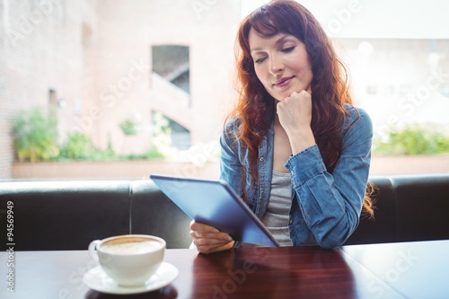 Mature student using tablet in cafe © WavebreakmediaMicro