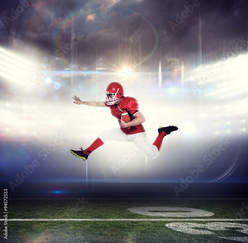 American football player jumping with the ball © vectorfusionart