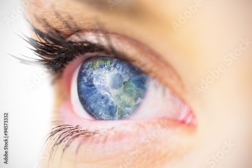 Composite image of close up of female blue eye