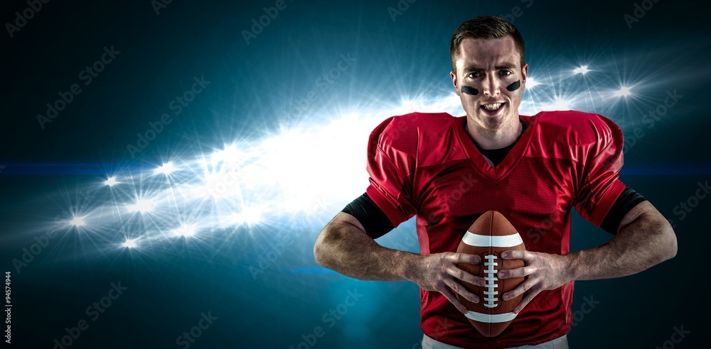 © vectorfusionart - Composite image of american football player holding ball